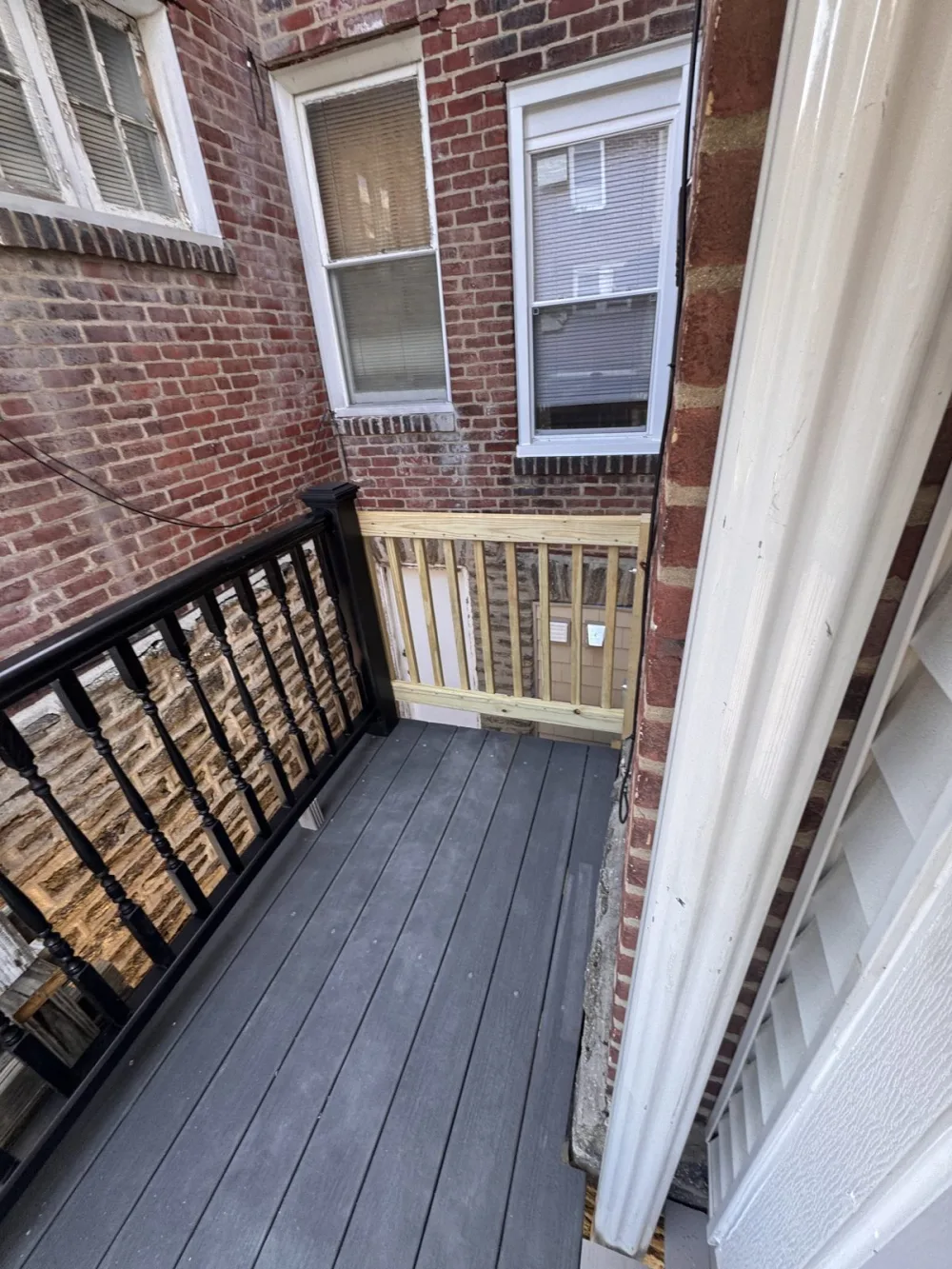 Outside last: the composite rear deck on 63rd Avenue.
