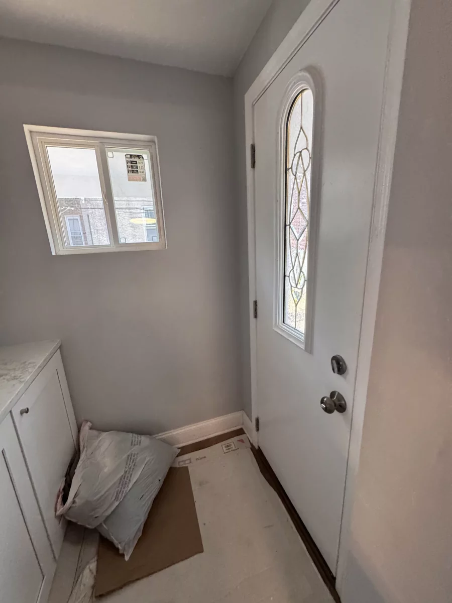 Painted entry with a glass-panel door and a window