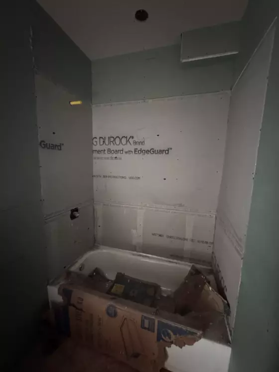 Tub alcove in cement board before tile during the bathroom remodel