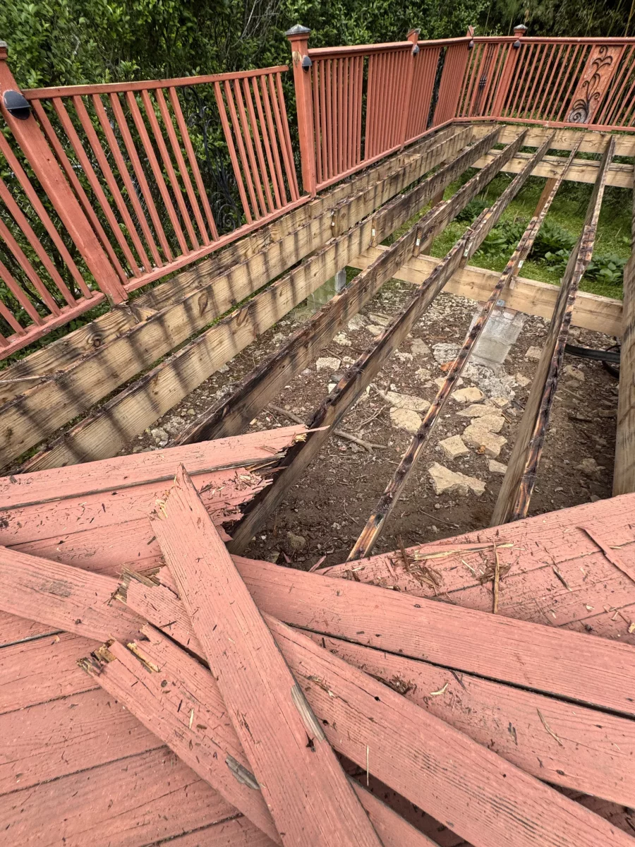 Old deck boards torn up during demolition