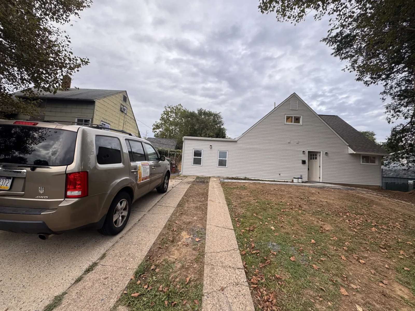 Front of the renovated Levittown house and driveway
