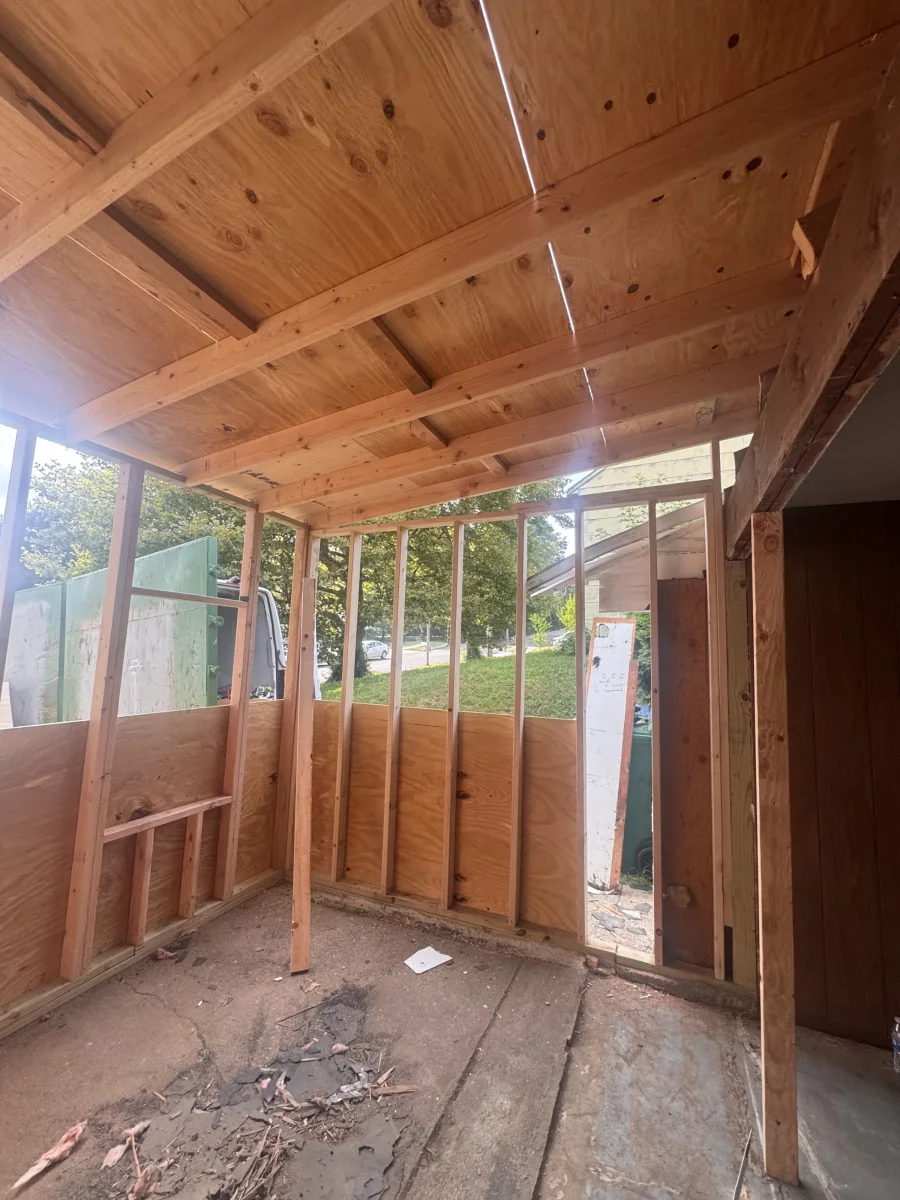 Framed walls and roof sheathing of the addition before drywall