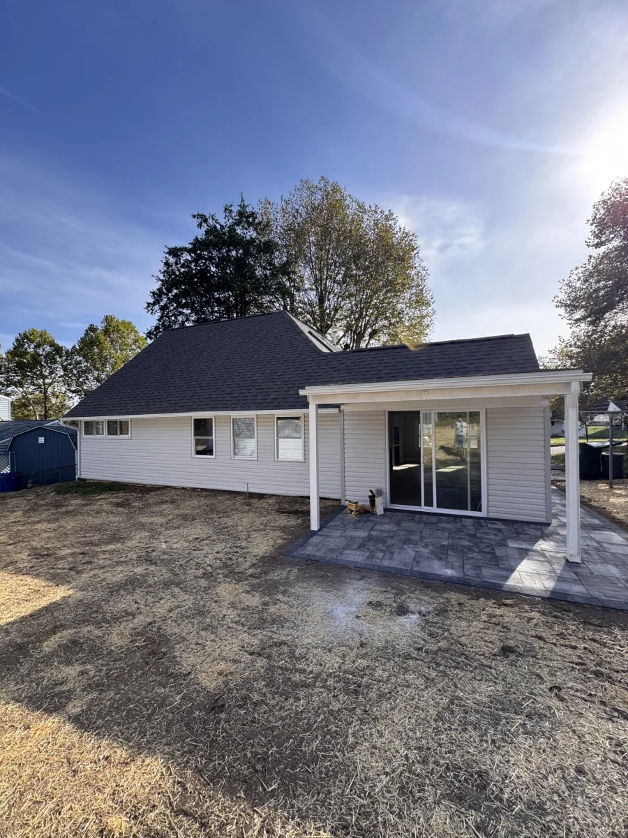 Back of the house with the covered porch and patio