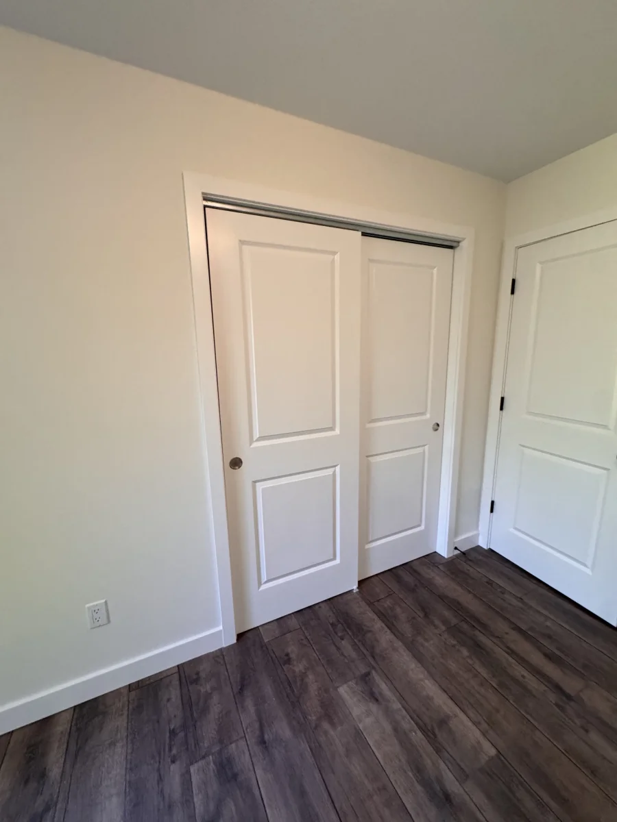 Bedroom with white closet doors