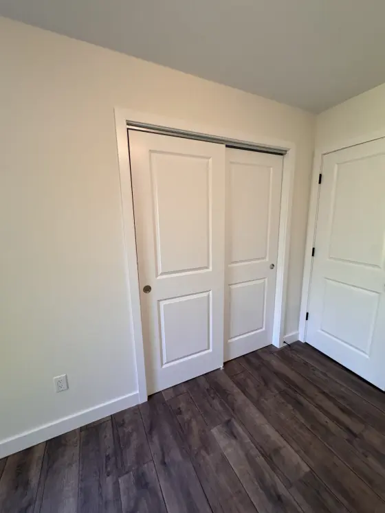 Bedroom with white closet doors